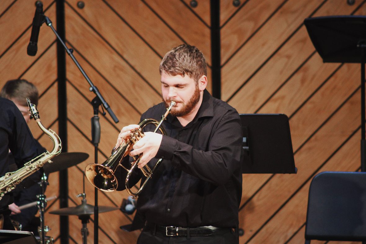 student playing cornet on stage