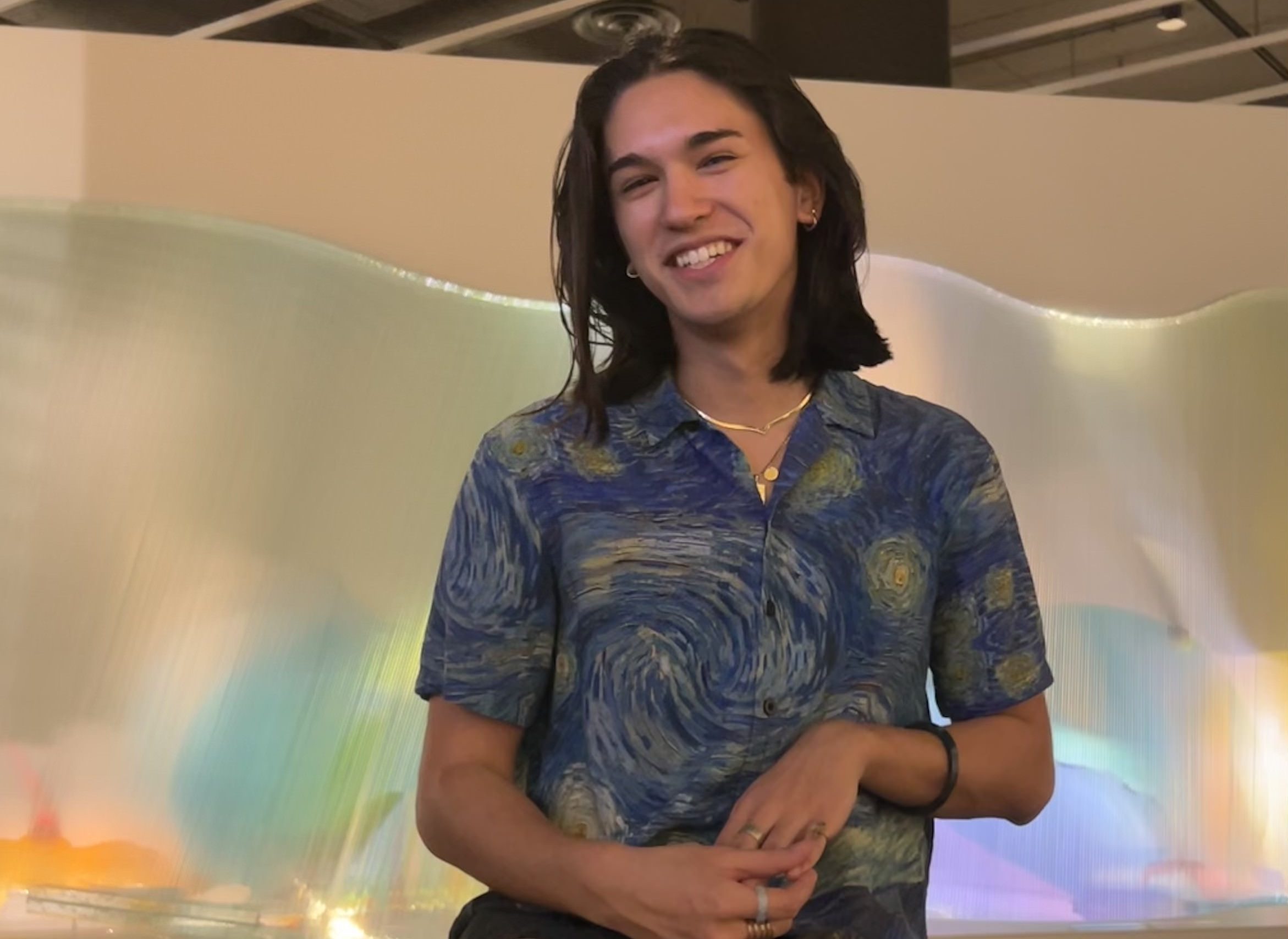 student sitting at a art exhibition