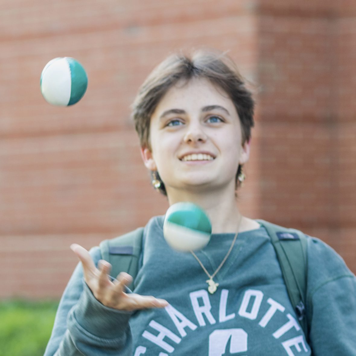 photo of theatre students juggling outdoors