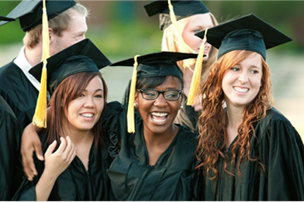 students graduating in cap and gown